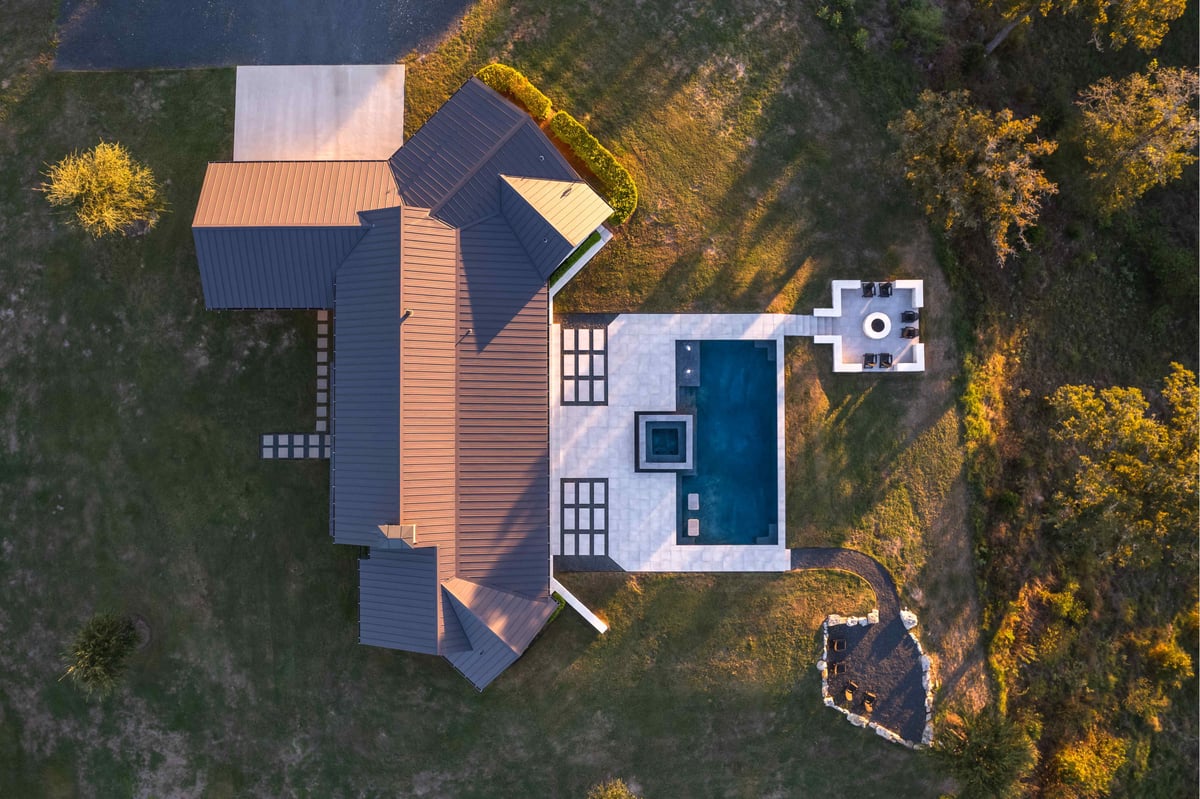 Birds eye view drone shot of modern central Texas home | J Bryant Boyd