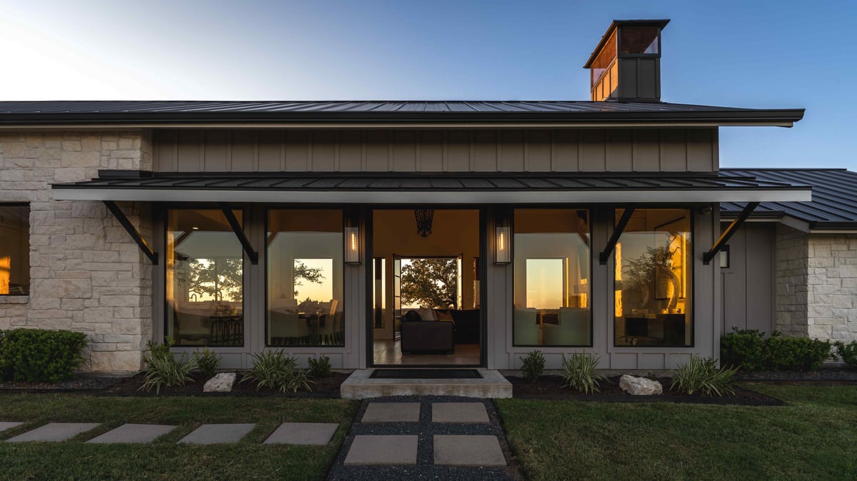 Stone path leading to modern glass doors on a modern Texas home | J Bryant Boyd