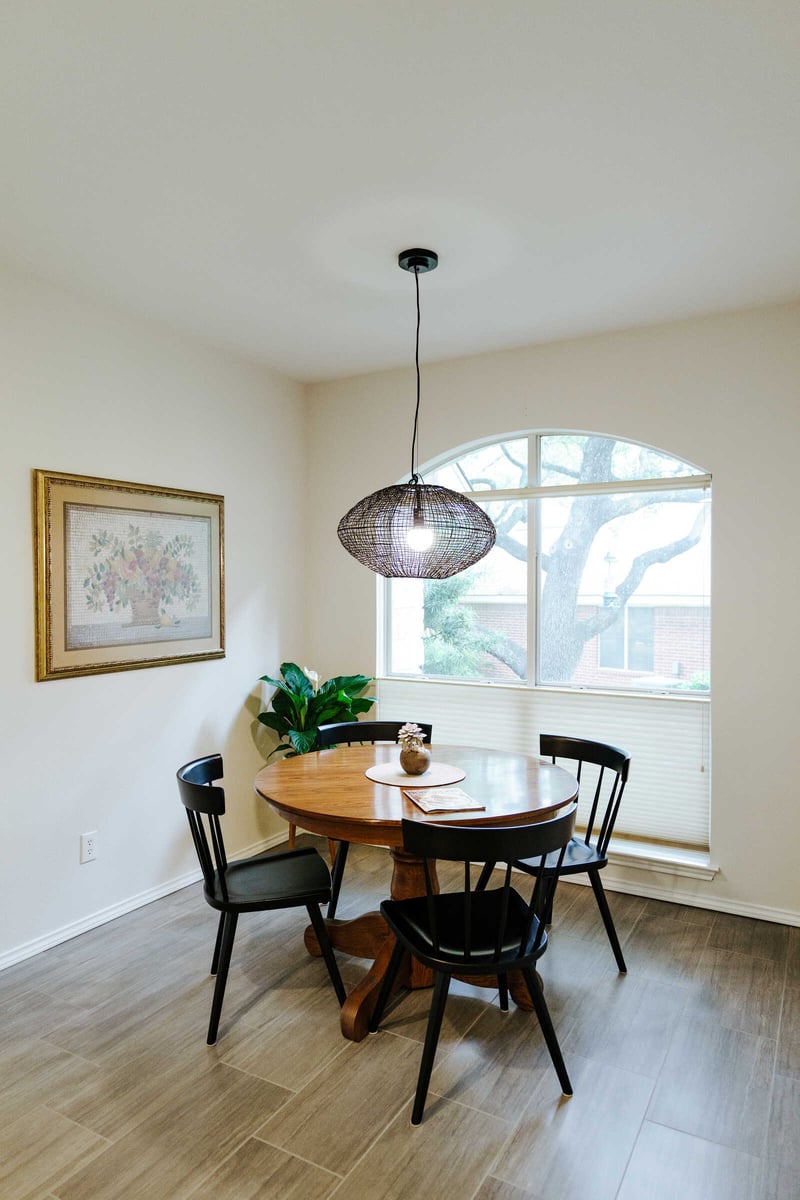 Cozy dining area with natural light in a remodeled Georgetown, TX home by J Bryant Boyd