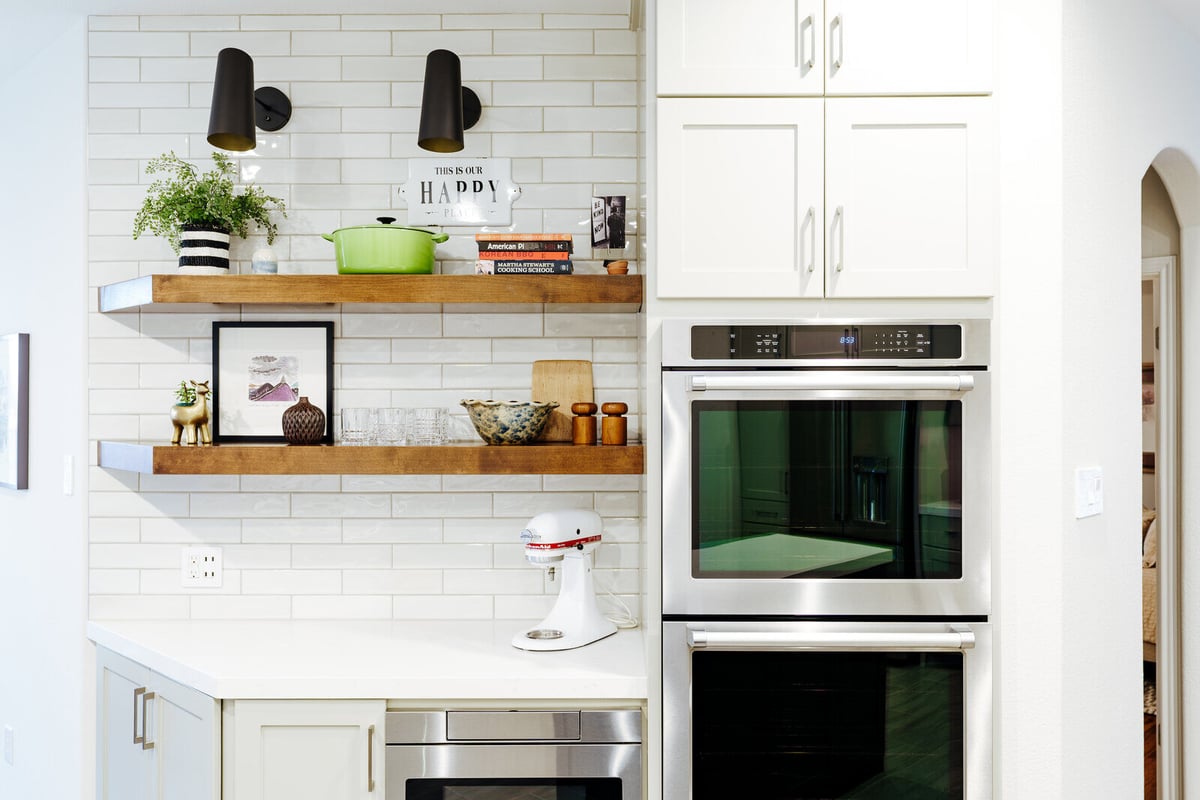 Stylish kitchen remodel showcasing modern design with stainless steel appliances and wooden accents by J Bryant Boyd in Georgetown, TX