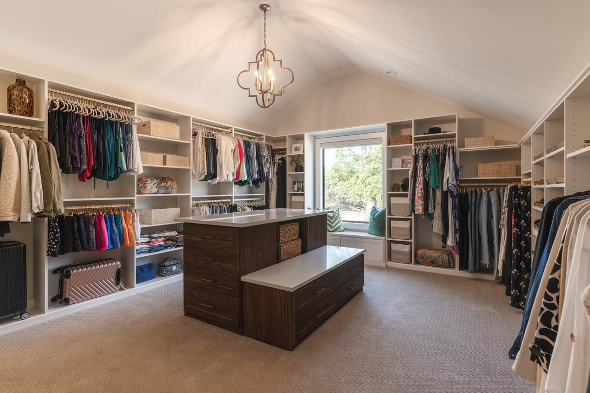 Large walk in closet with bench seat on window | J Bryant Boyd