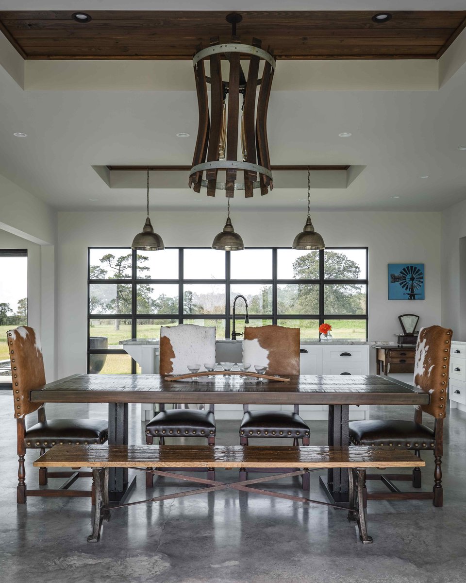 Dining room with unique lighting fixture and bench seat | J Bryant Boyd