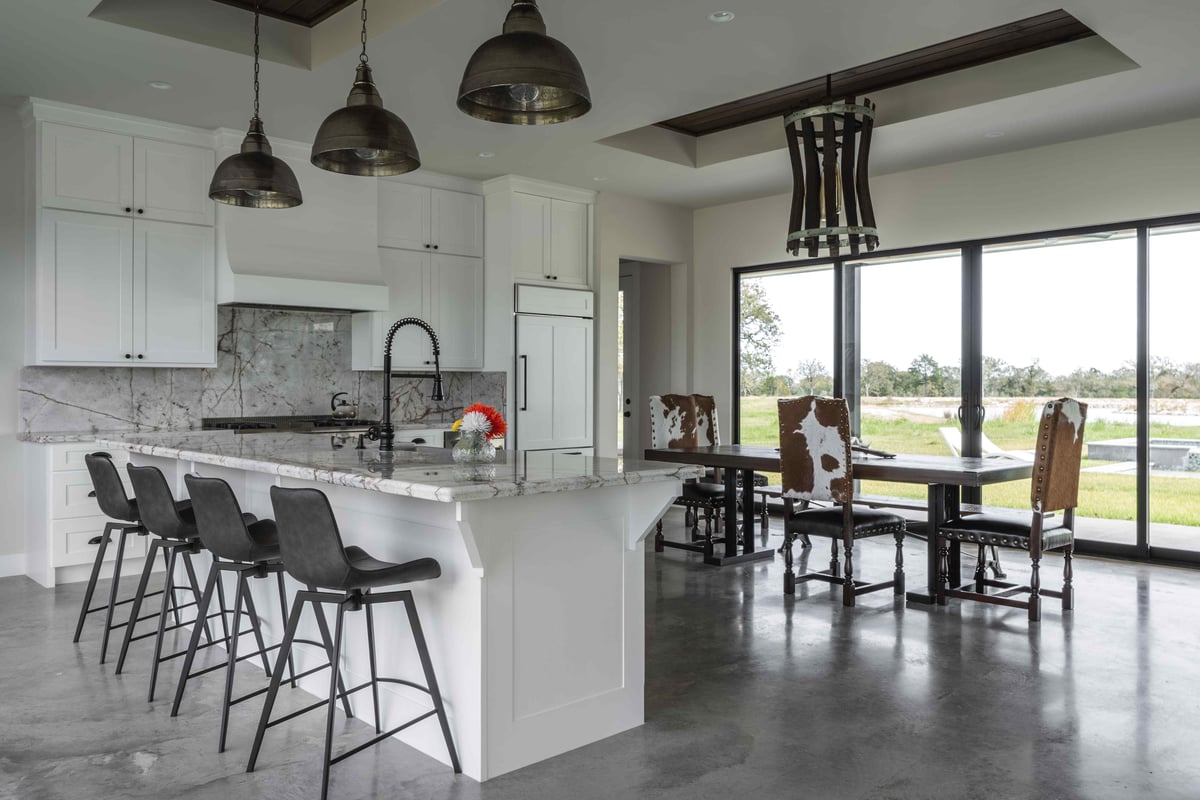 Modern kitchen with in sink counter and countertop seating | J Bryant Boyd