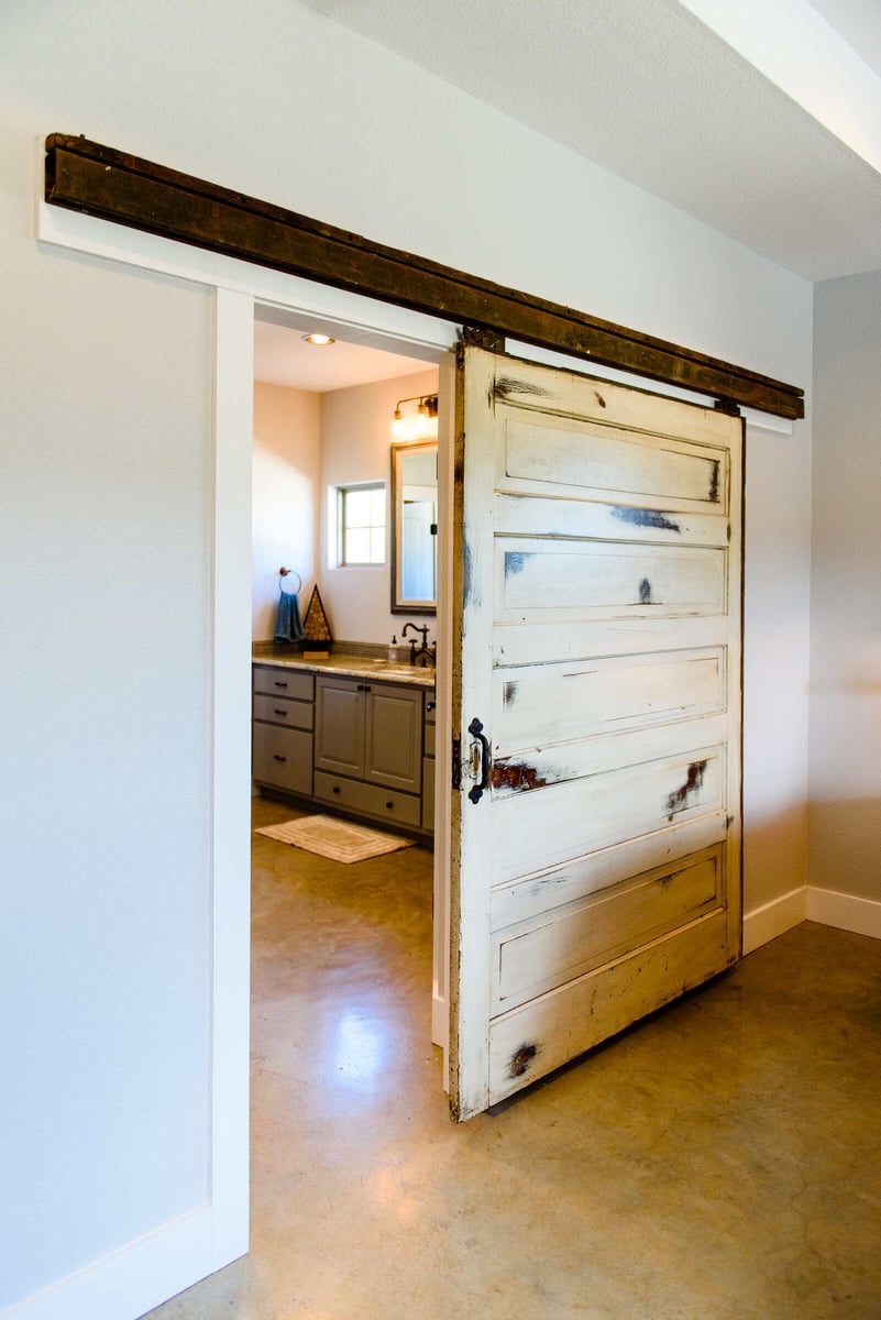 Custom bathroom vanity with double sinks and rustic decor in Georgetown, TX by J Bryant Boyd
