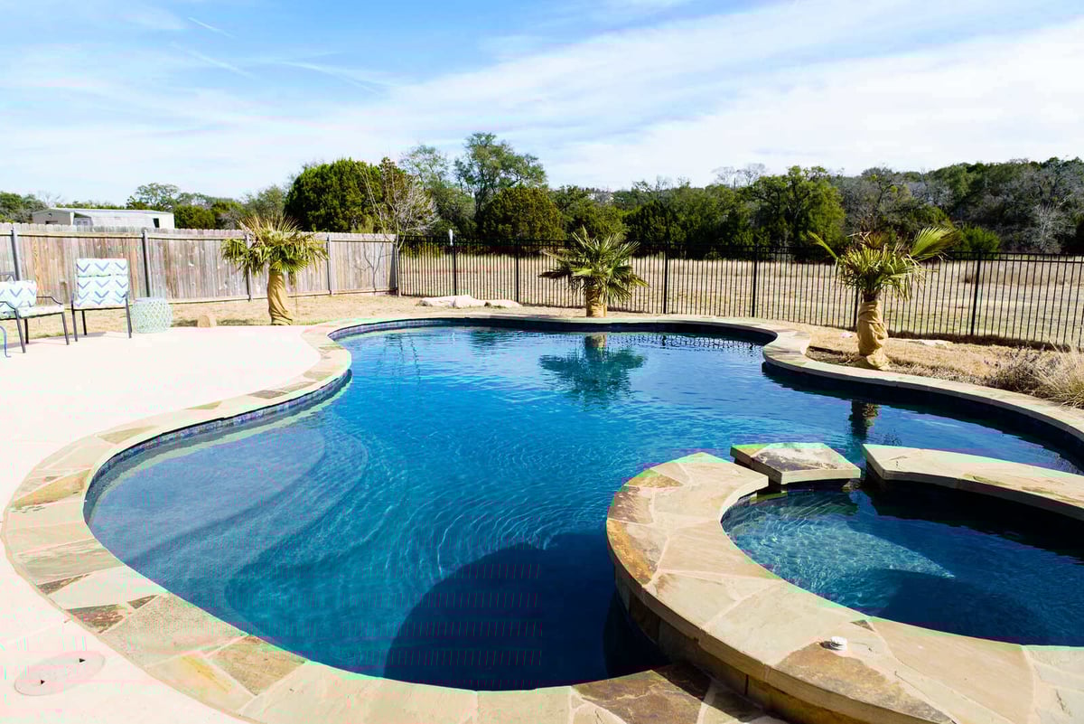 Custom-built pool in Georgetown, TX backyard by J Bryant Boyd