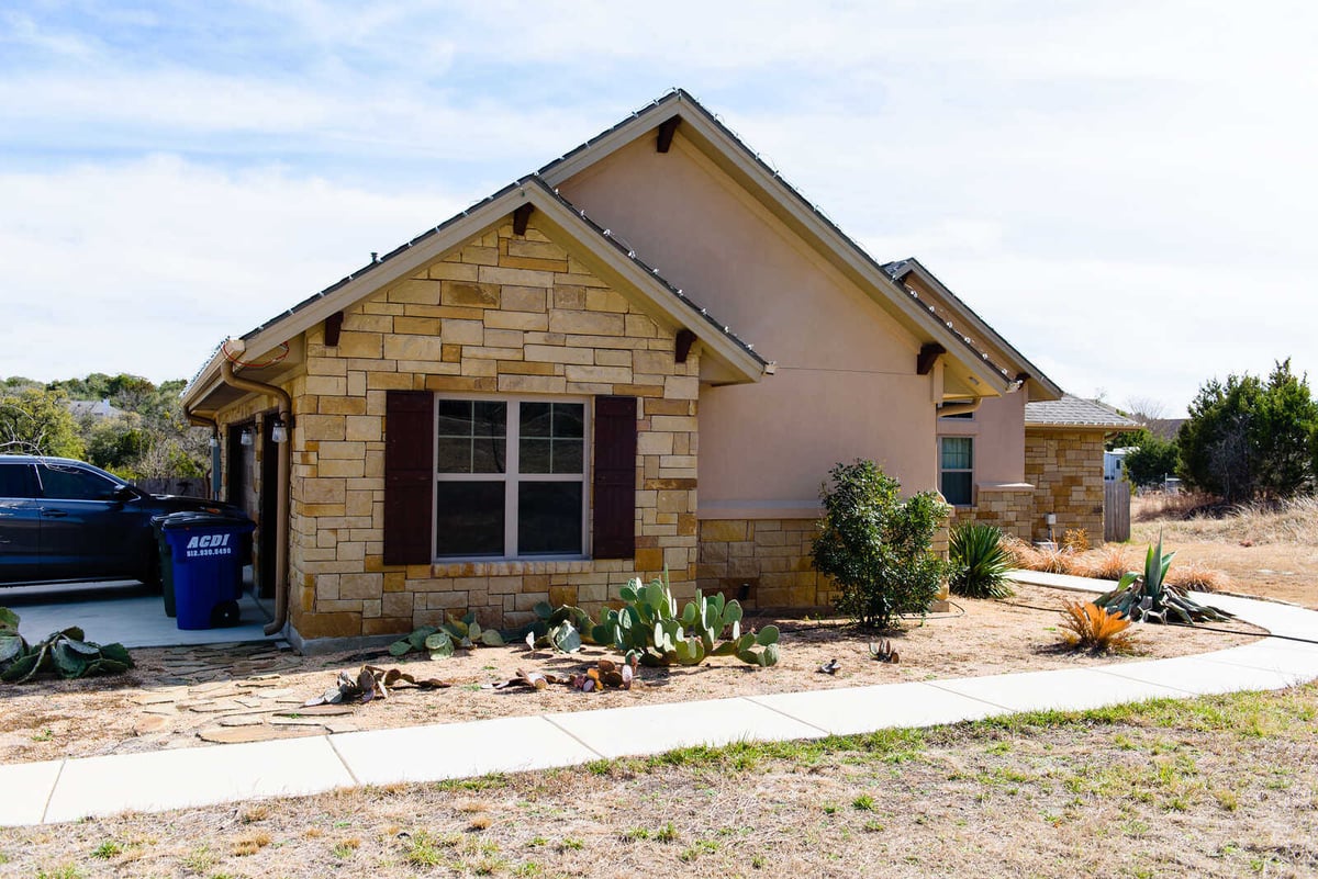 Exterior view of a custom home by J Bryant Boyd in Georgetown, TX