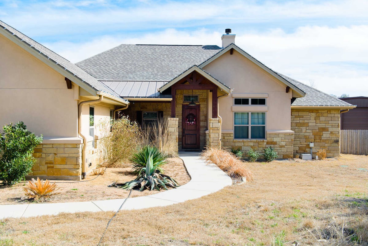 Front entrance of a custom home by J Bryant Boyd in Georgetown, TX