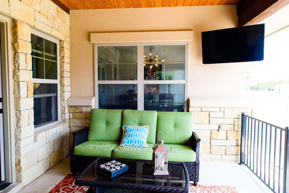 Outdoor seating area on a covered patio by J Bryant Boyd, Georgetown, TX