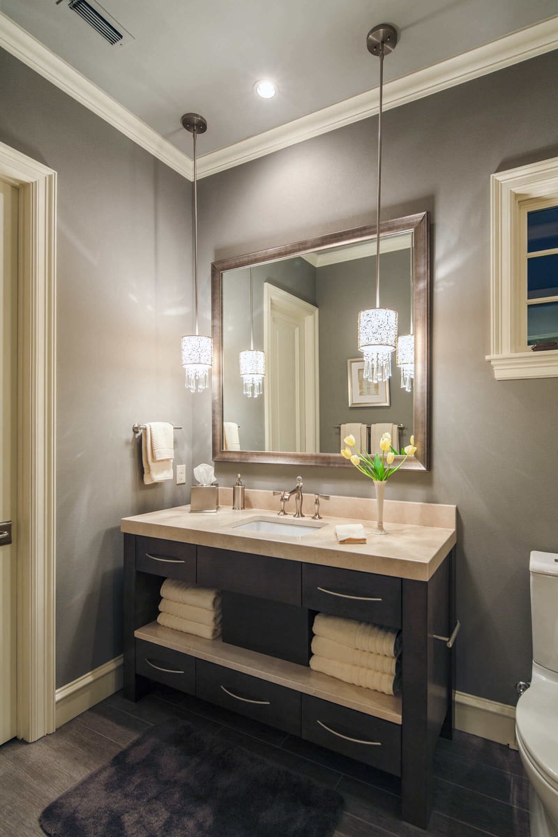 Custom bathroom remodel with modern lighting and fixtures by J Bryant Boyd in Georgetown, TX