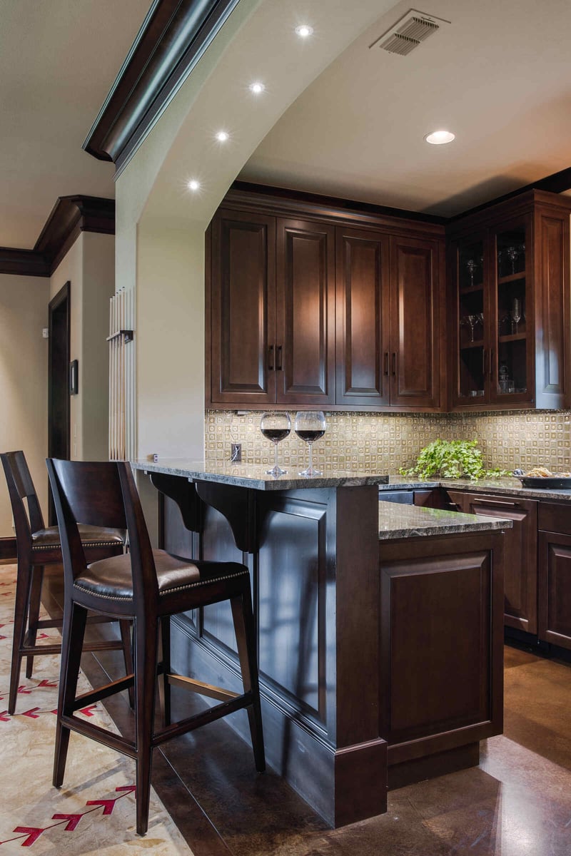 Custom home game room with large TV and leather seating area by J Bryant Boyd in Georgetown, TX