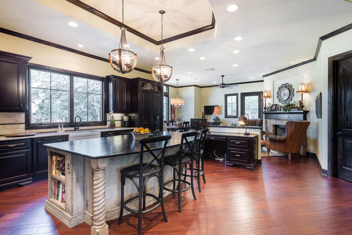 Open kitchen and living space in a custom home by J Bryant Boyd in Georgetown, TX