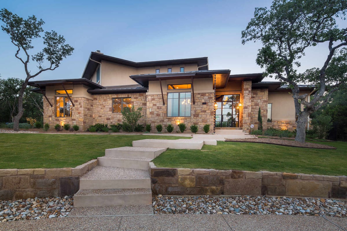 Stone facade exterior of a custom home by J Bryant Boyd in Georgetown, TX