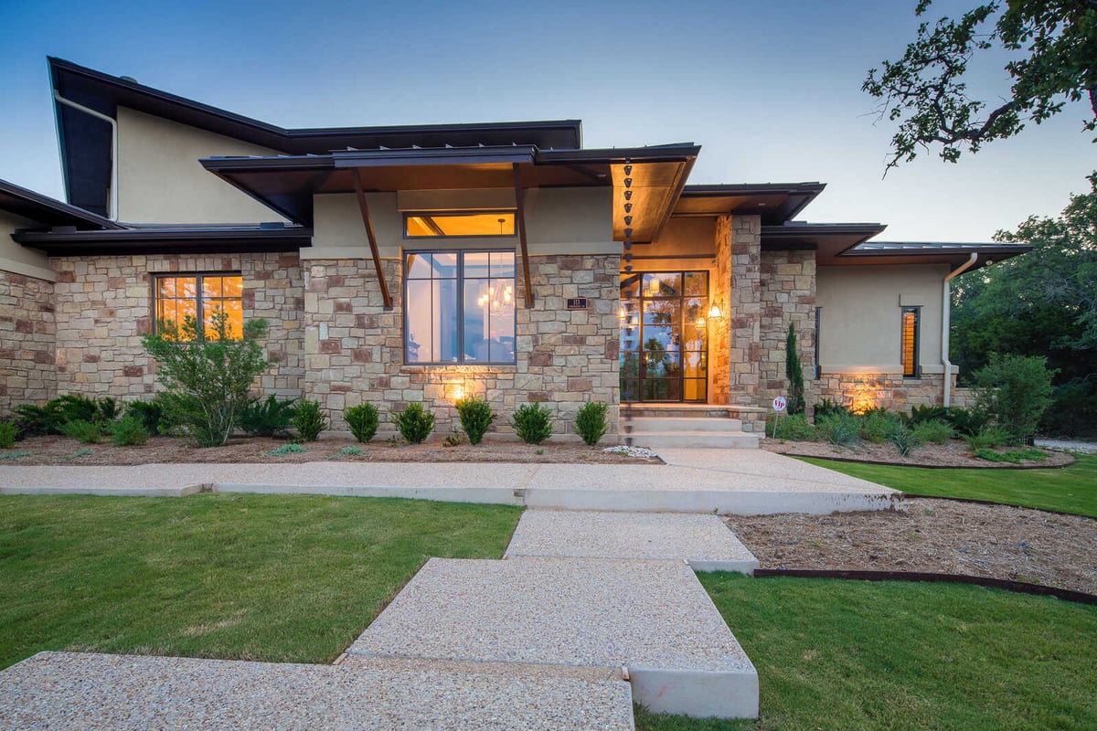 Stone-accented entryway of a custom home by J Bryant Boyd in Georgetown, TX