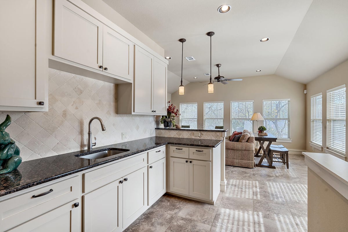 Bright kitchen area leading to a staircase, custom home by J Bryant Boyd in Georgetown, TX