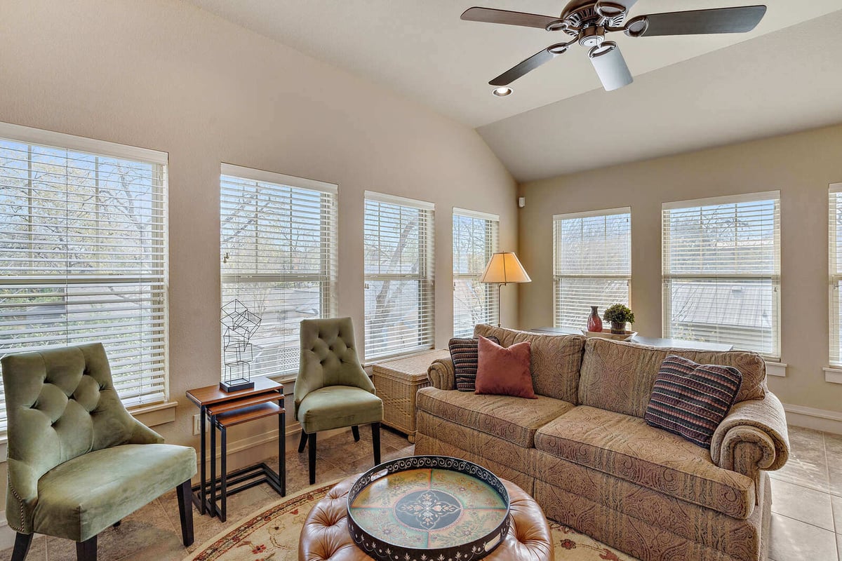 Cozy living room with multiple windows allowing natural light, custom home by J Bryant Boyd in Georgetown, TX