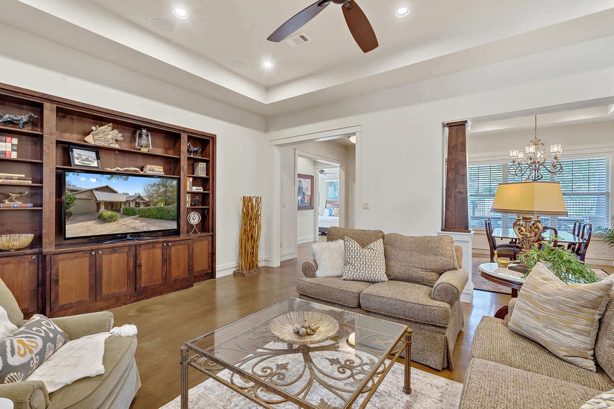 Dining area with elegant table setting and chandelier in a custom home by J Bryant Boyd in Georgetown, TX