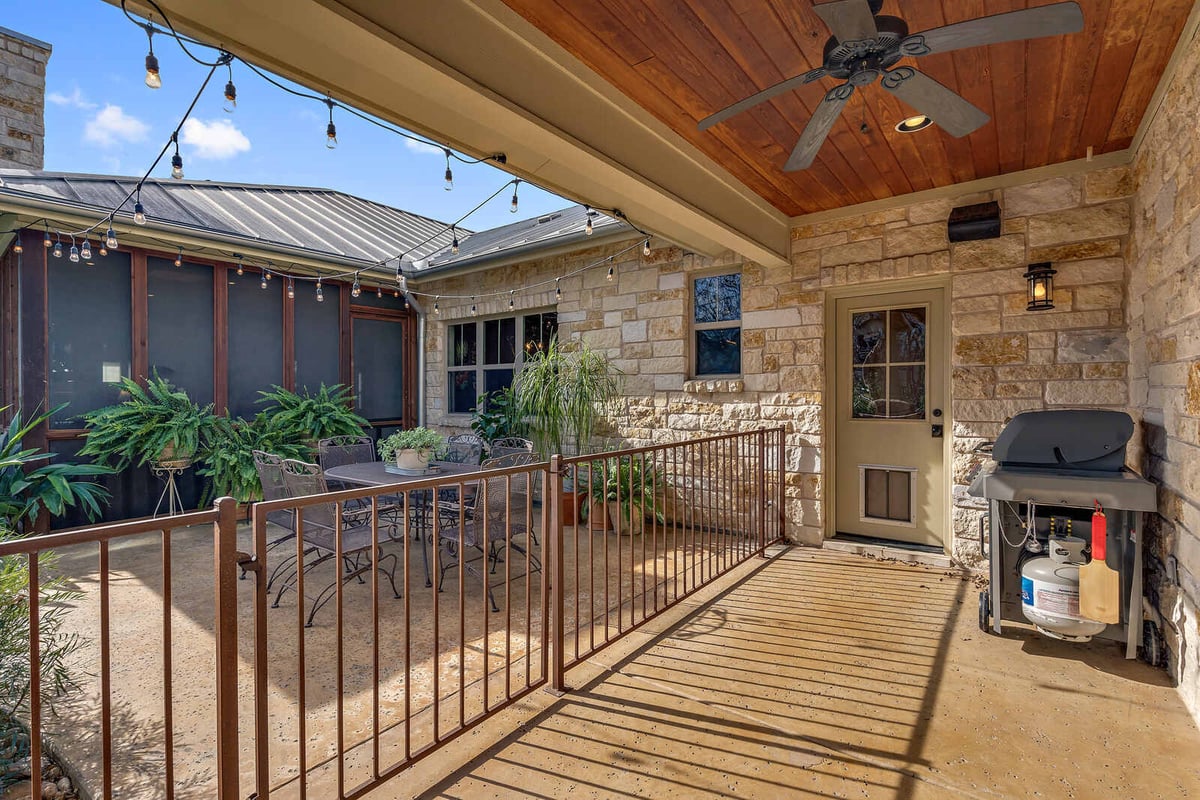 Spacious laundry room with dark cabinetry and built-in sink in a Georgetown, TX custom home by J Bryant Boyd