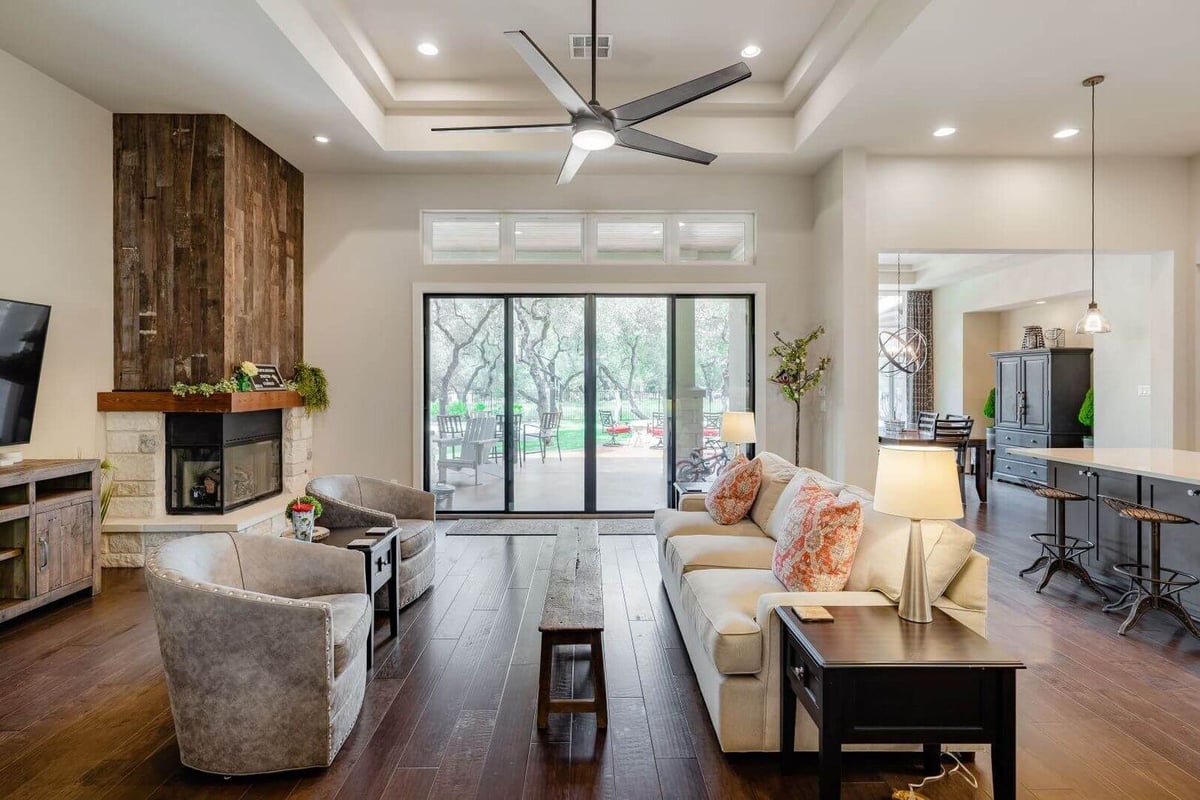 Cozy living room with fireplace in a custom home by J Bryant Boyd, Georgetown, Texas