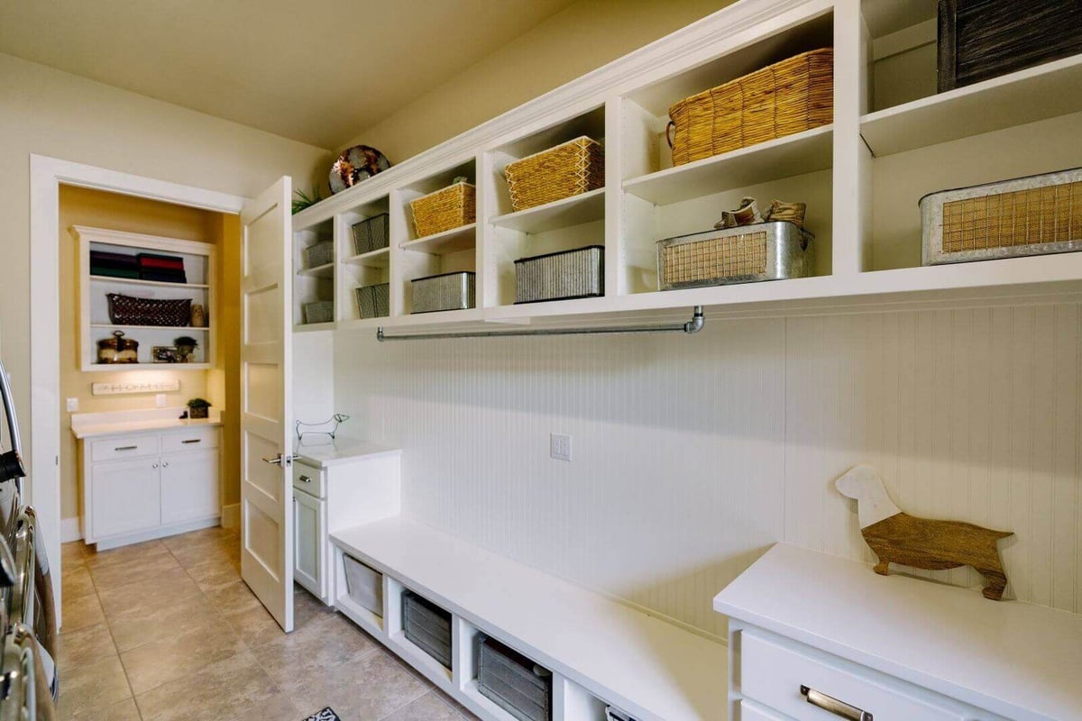 Laundry room with built-in storage in a custom home by J Bryant Boyd, Georgetown, Texas