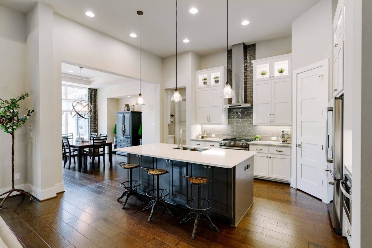Open kitchen and dining area in a custom home by J Bryant Boyd in Georgetown, Texas