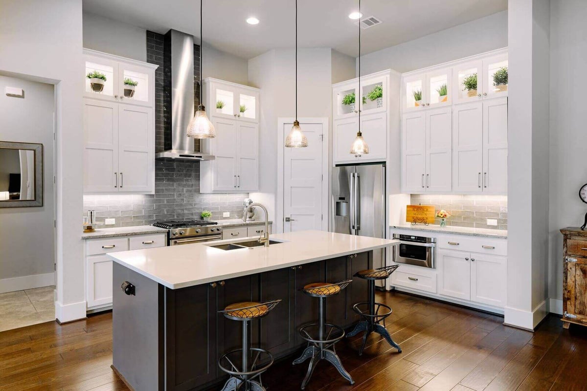 Sleek and modern kitchen design in a custom home by J Bryant Boyd in Georgetown, Texas
