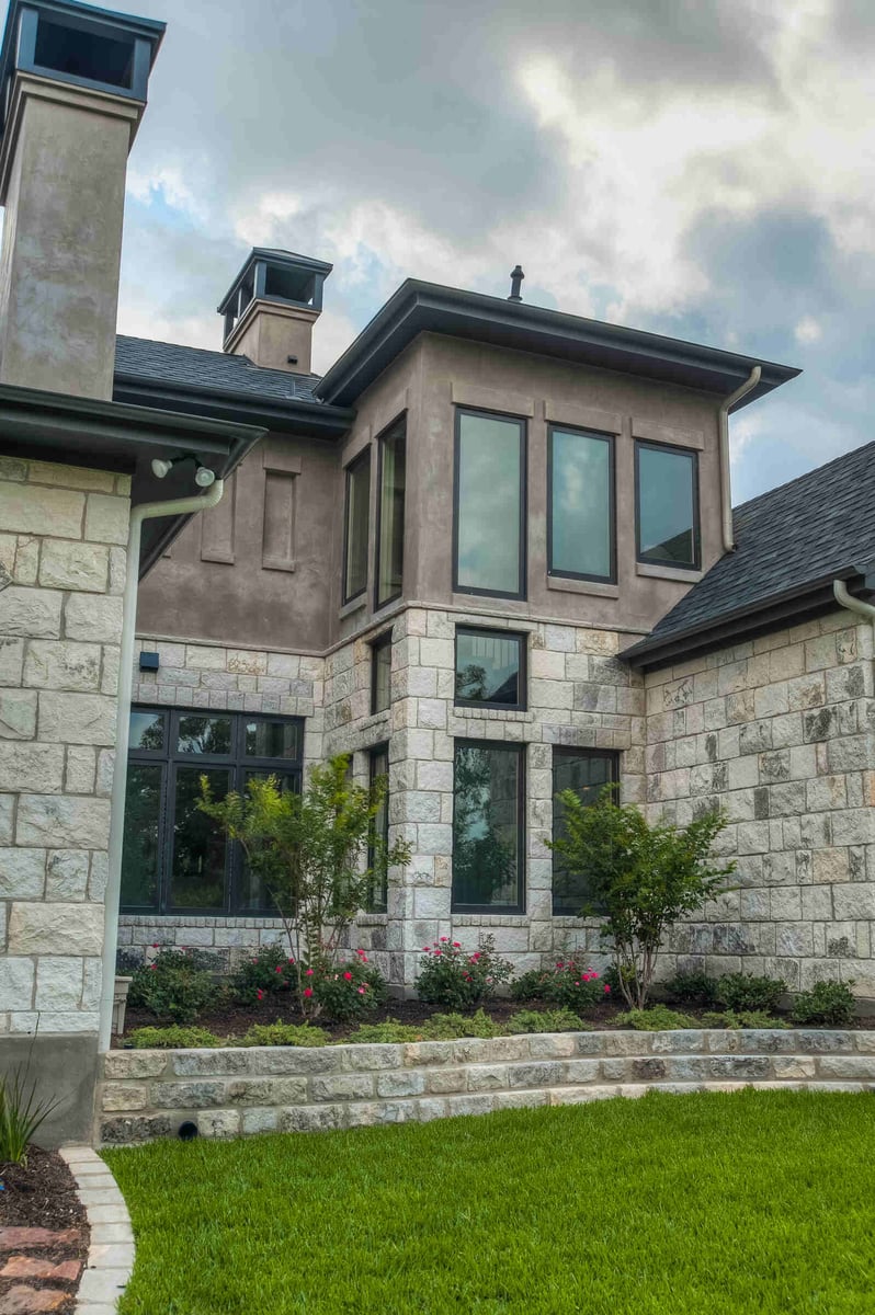 Detailed view of custom stonework and landscaping on a luxury Georgetown home by J Bryant Boyd