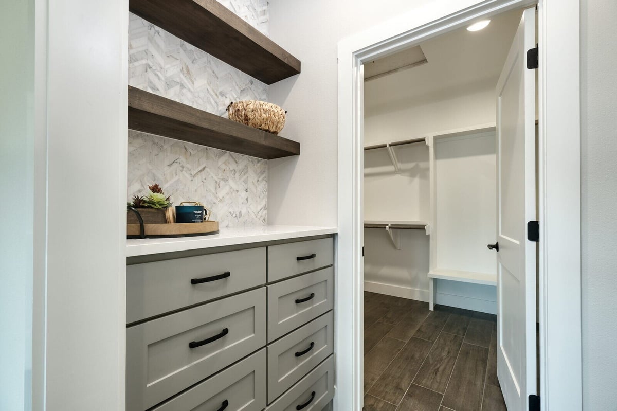 Custom closet with organized shelving by J Bryant Boyd in Georgetown, Texas