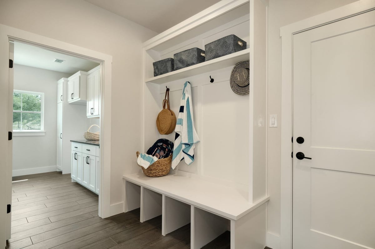 Custom-built mudroom with storage benches by J Bryant Boyd in Georgetown, Texas