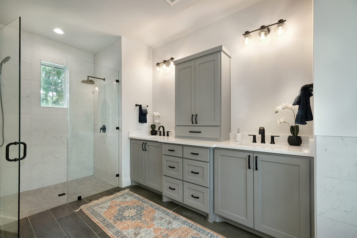 Modern bathroom with white subway tile shower by J Bryant Boyd in Georgetown, Texas