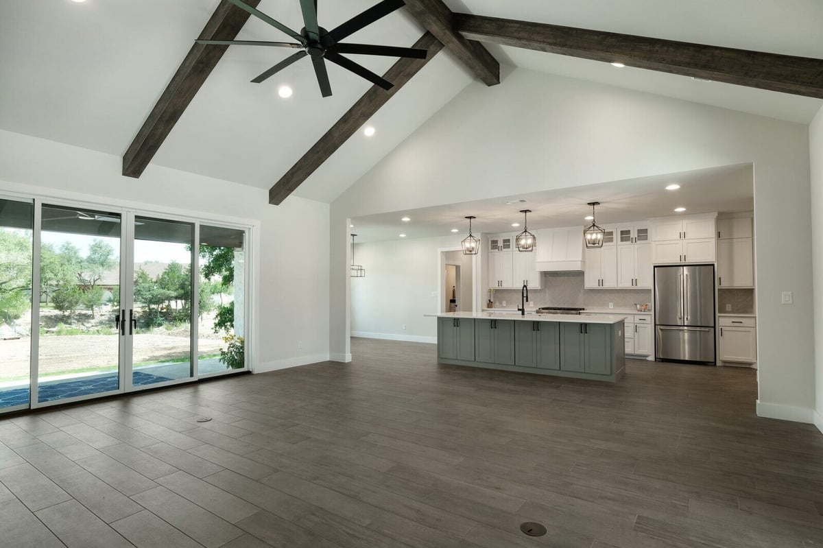 Open kitchen and living space in a custom home by J Bryant Boyd in Georgetown, Texas