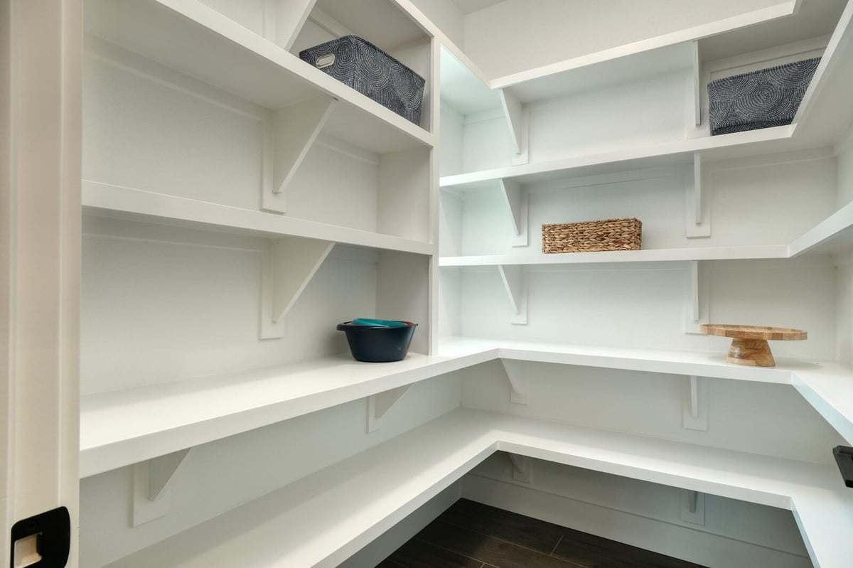 Walk-in pantry with custom shelving by J Bryant Boyd in Georgetown, Texas
