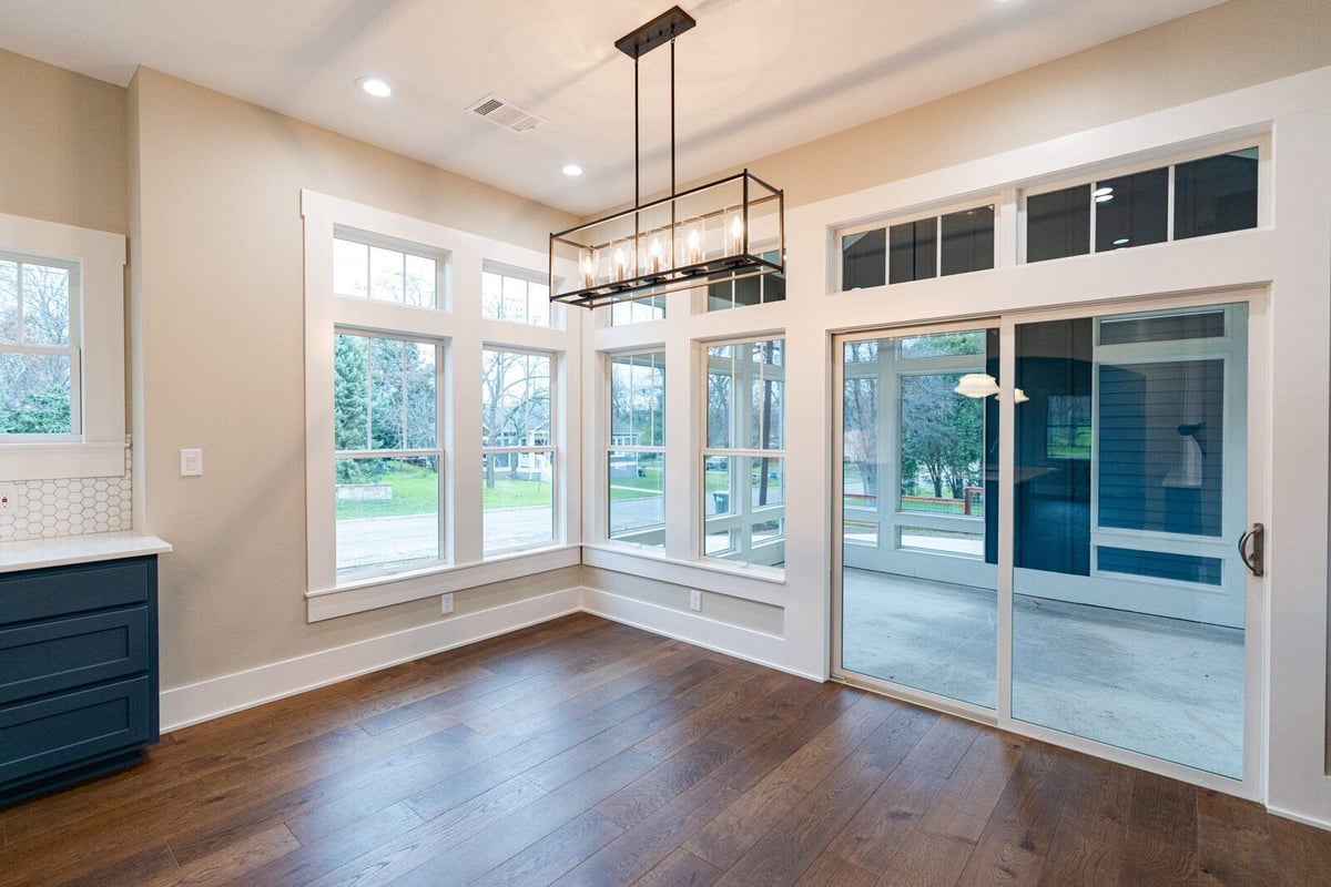 Bright dining area with large windows in Georgetown, Texas, by J Bryant Boyd