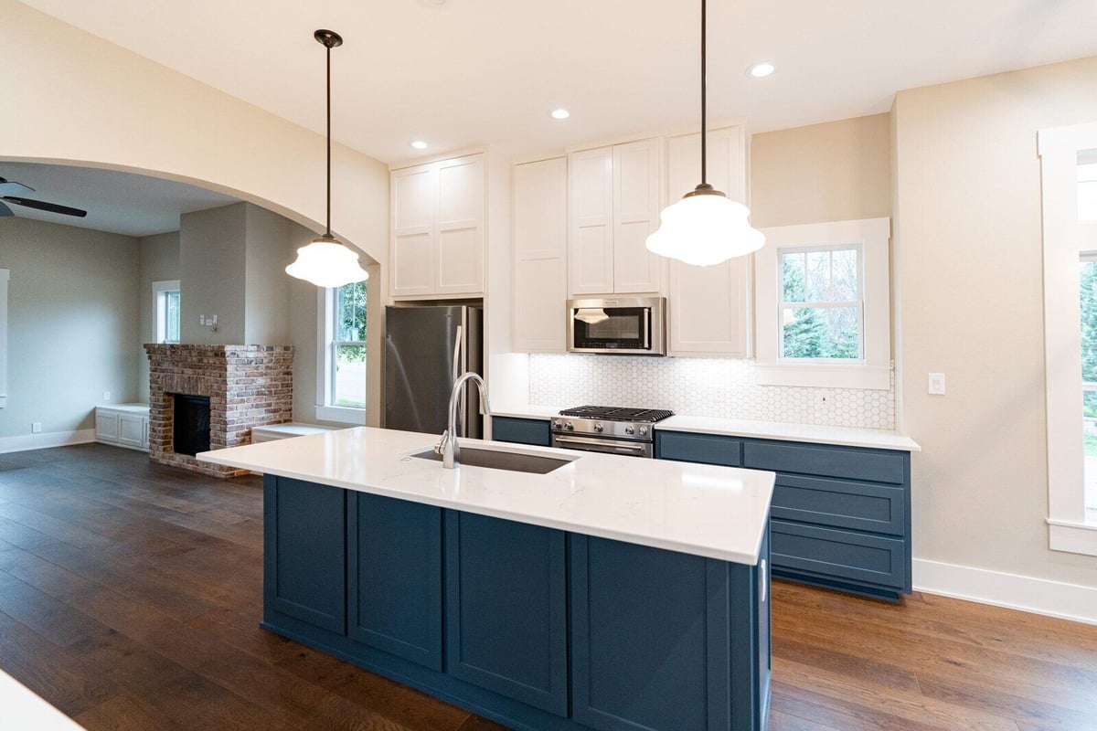 Modern kitchen design with a central island, custom-built by J Bryant Boyd in Georgetown, Texas