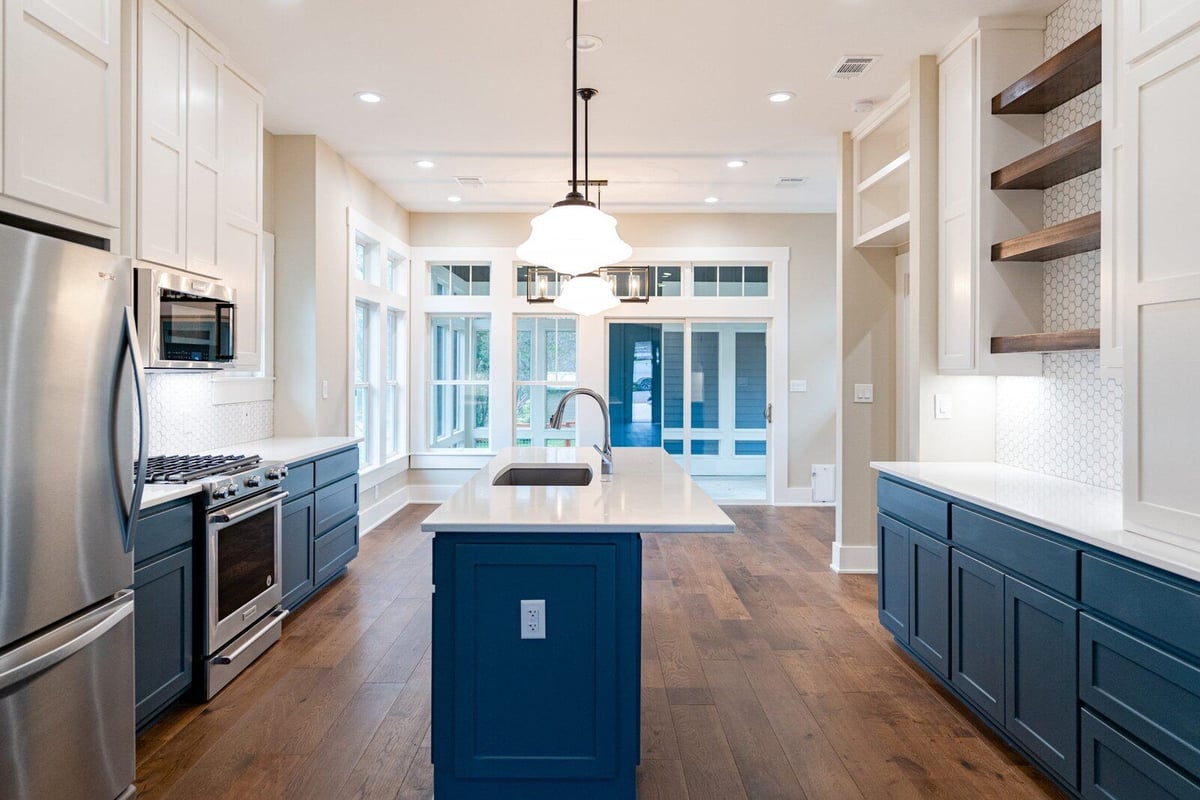 Spacious kitchen with island and modern appliances in Georgetown, Texas, by J Bryant Boyd