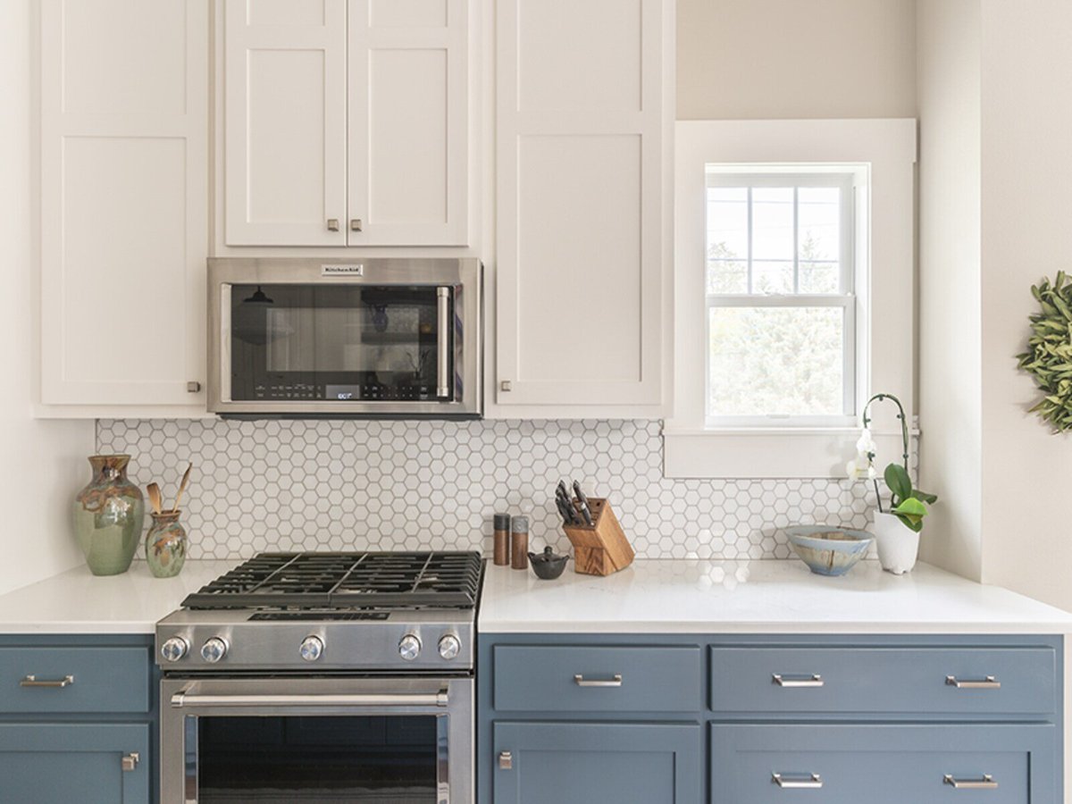 hexagonal backsplash on kitchen white and blue cabinets j bryant boyd georgetown tx