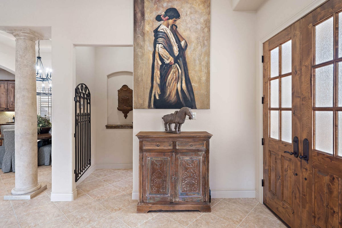 Artistic hallway in a custom home by J Bryant Boyd in Georgetown, TX, with unique decor and wooden double doors-1