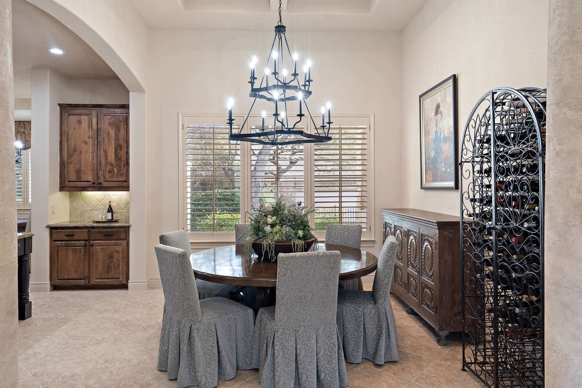 Custom dining area with a view into the kitchen in a J Bryant Boyd home in Georgetown, TX