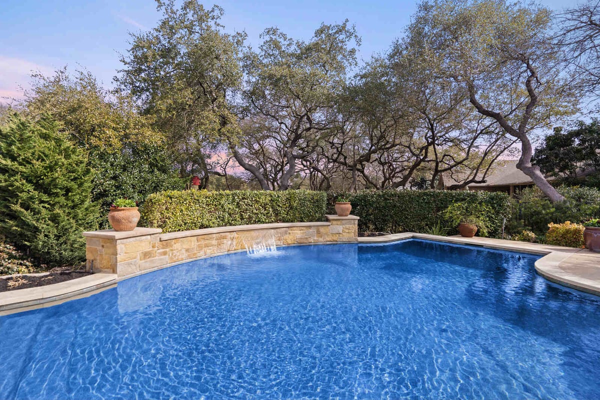 Custom home backyard pool with stone wall and waterfall feature by J Bryant Boyd in Georgetown, TX-1