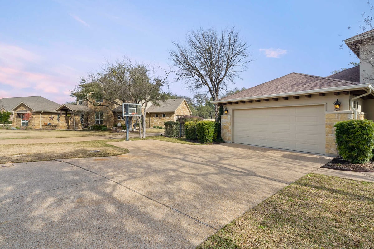 Custom home driveway with basketball hoop by J Bryant Boyd, Georgetown, TX